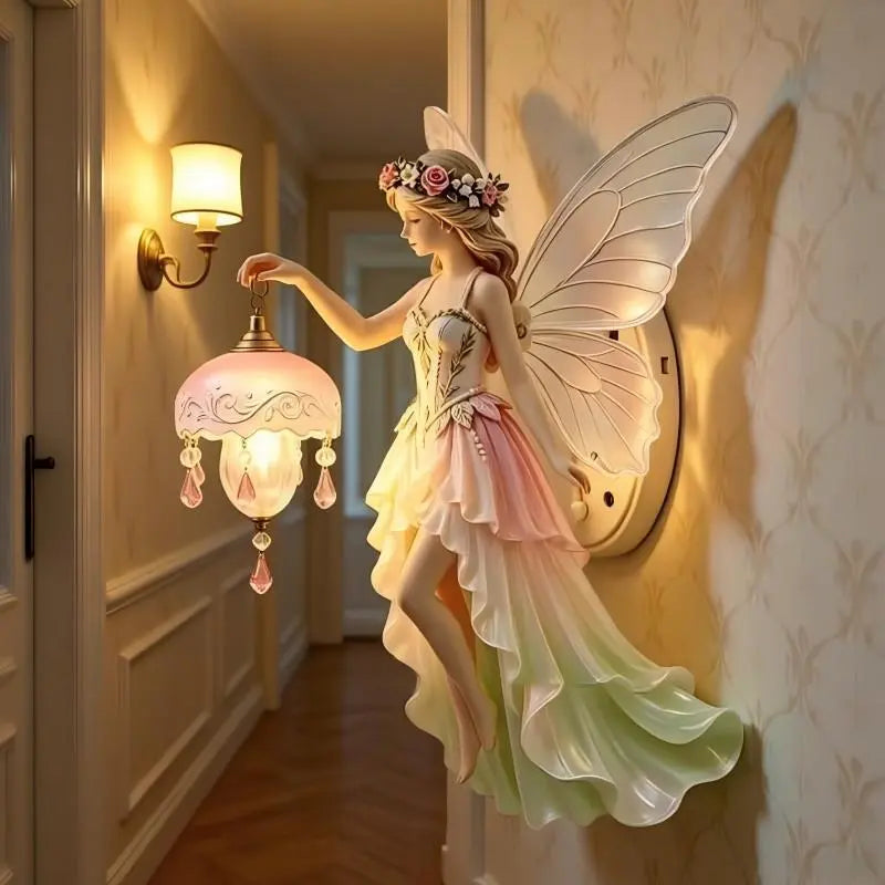 Fairy wall lamp with pastel dress, floral crown, and delicate wings, holding a glowing light.