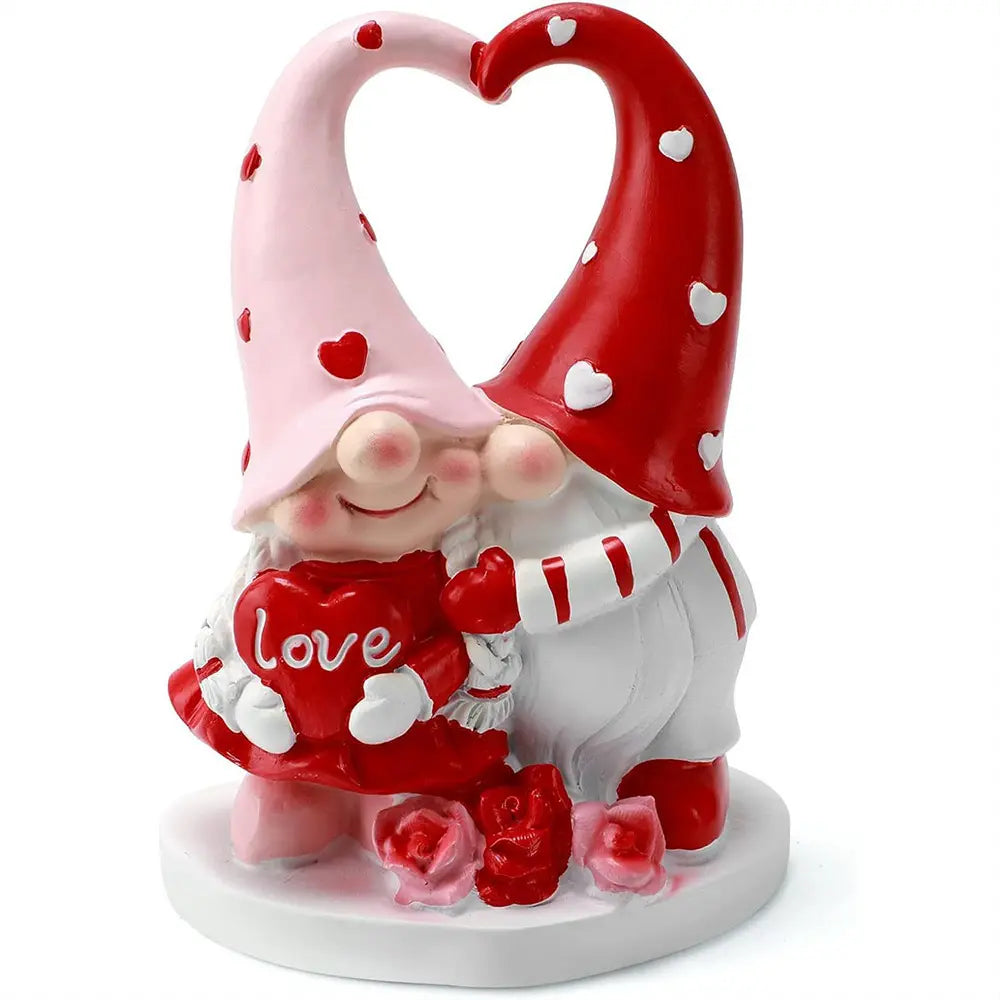 Two gnomes with heart hats hugging, holding a red heart labeled "love," surrounded by roses.