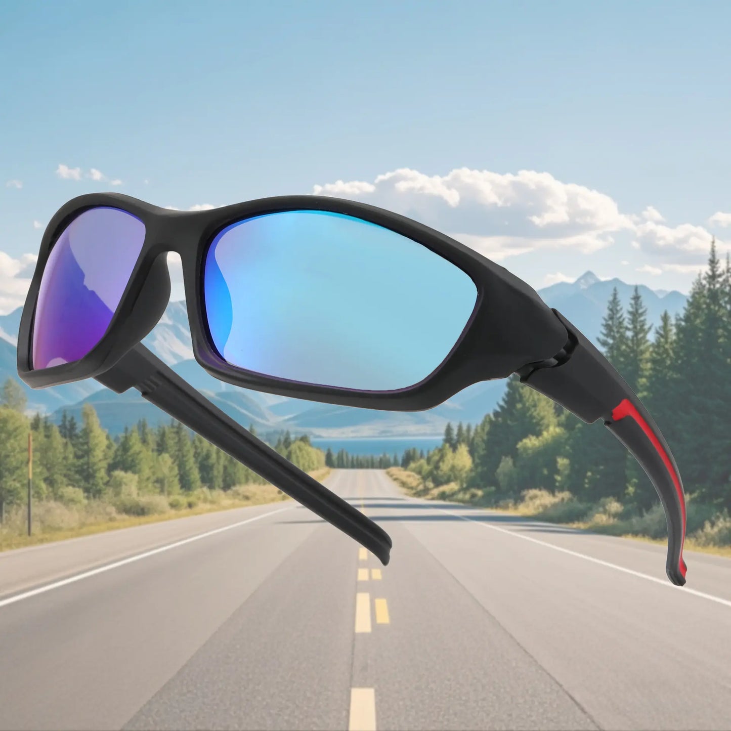 Sunglasses with blue lenses and black frame, set against a scenic road and mountain backdrop.