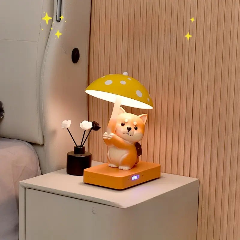 A cat-shaped lamp with a yellow mushroom shade on a bedside table, next to a black vase.