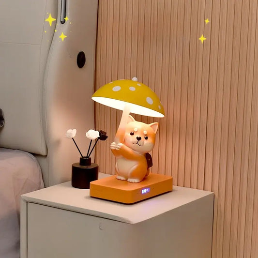 A cat-shaped lamp with a yellow mushroom shade on a bedside table, next to a black vase.