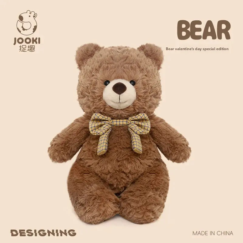 A brown teddy bear with a checked bow tie on a beige background, labeled "BEAR" and "Jooki."